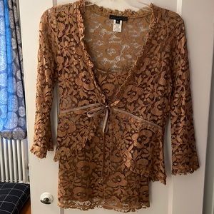 Beautiful for fall.  Burnt orange lace camisole with jacket that ties in front.